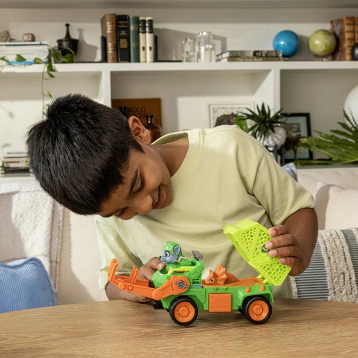 Child playing with the Rocky Dino Rescue Recycler and its open rear basket