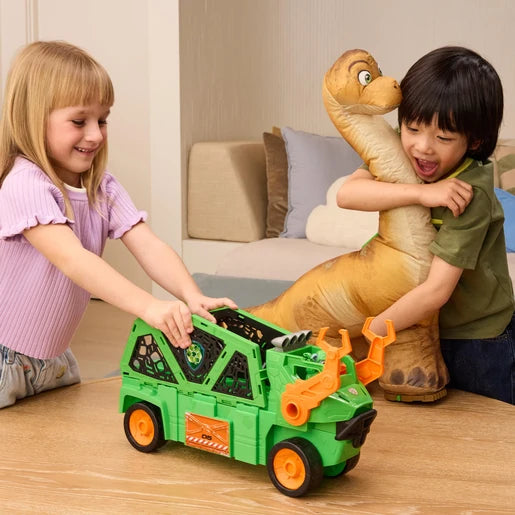 Two children playing with the green Megasaurus Dino Vehicle and inflated long neck dinosaur