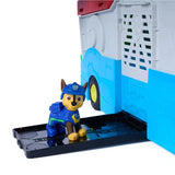 Chase figure standing on the open side platform of the PAW Patrol Dino Mobile Headquarters