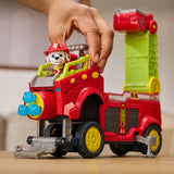 Hand placing Marshall into the cab of the Dino Rescue Responder vehicle with the ladder raised
