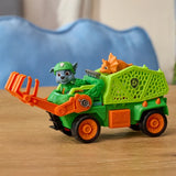 Rocky seated in the green Dino Rescue Recycler with an orange dinosaur figure in the rear basket