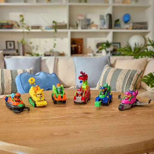 Six PAW Patrol vehicles lined up on a table