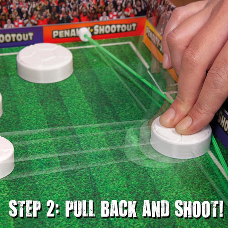 John Adams Penalty Shoot Out gameplay showing a player pulling back a football puck against the elastic to shoot