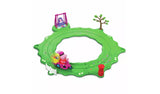 Peppa & Evie Fun in the Park Playset assembled on a white background, with a circular green road track, Peppa riding a pink bike with a yellow basket, Evie in a purple swing, a tree, white fence and red post box.
