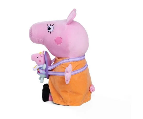 Side view of large Mummy Pig plush in orange dress with small baby pig soft toy attached to the front via a purple strap