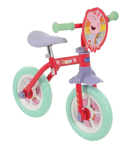 Peppa Pig training bike with mint wheels, purple saddle and front character plaque shown from a right angled view