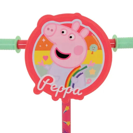 Close-up of Peppa Pig scooter handlebar plaque with rainbow design in Ireland