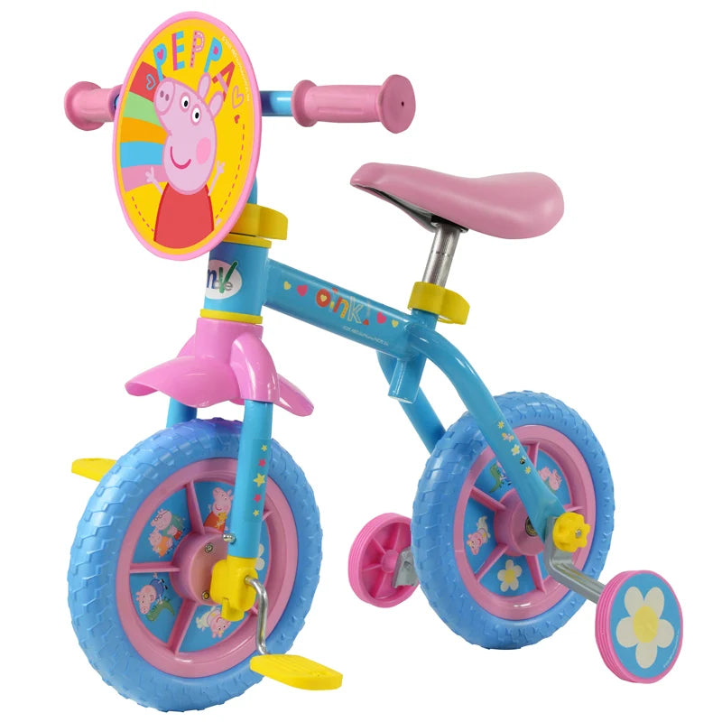 Peppa Pig 10 Inch Training Bike with pedals and stabilisers fitted, showing the blue frame, pink wheels and Peppa Pig front plaque