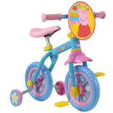 Peppa Pig 10 Inch Training Bike with pedals and stabilisers fitted, showing the blue frame, pink saddle and front character plaque