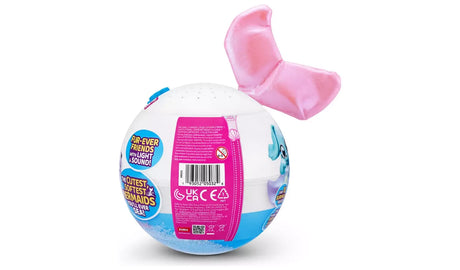 Rear view of Pets Alive Furmaids Series 1 capsule packaging with product information panel, barcode, CE marks and attached pink tail fin piece