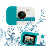 Photo Creator Waterproof Digital Camera showing front and rear views of the turquoise and white camera surrounded by water splashes, with two smiling children pictured underwater on its rear screen.
