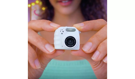 White Photo Creator Mini Cam held between two hands