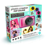 Photo Creator Pop Colour Camera Pink retail box viewed from the front and left side, showing the pink digital camera, yellow, purple and turquoise colour options, 32 megapixel specification, photo and video features, selfie function and 20 photo frames.