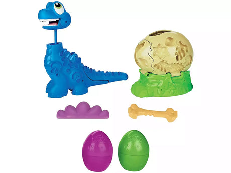 Complete contents of Play-Doh Growin' Tall Bronto including dinosaur toy, cracked egg, tools, and eggs – Ireland