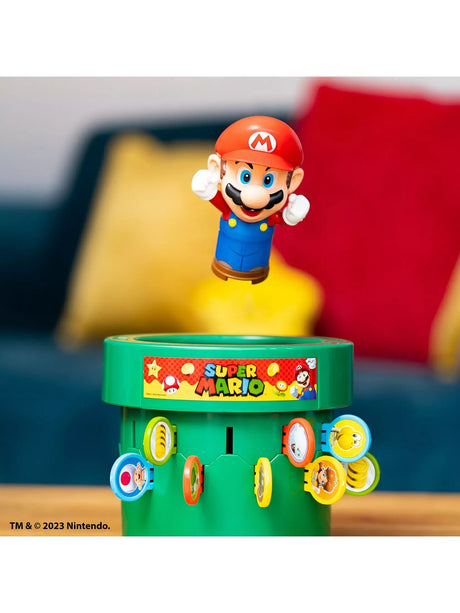 Pop Up Super Mario green pipe game with coloured paddles and Mario figure above the pipe