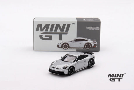 Mini GT Porsche 911 Dakar Ice Grey Metallic model displayed in front of its grey Mini GT box with the car pictured on the packaging