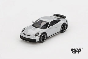 Mini GT Porsche 911 Dakar Ice Grey Metallic LHD prototype viewed from the front left showing the raised stance, black bonnet vents and black wheels