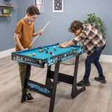 Two children playing on a folding pool table with blue playing surface