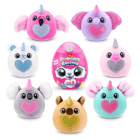Seven Rainbocorns Eggzania Baby plush characters in assorted colours with glitter hearts arranged around pink Eggzania surprise egg