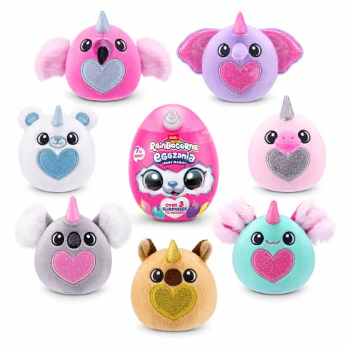 Rainbocorns Eggzania Baby Mania pink surprise egg surrounded by seven plush characters with glitter heart patches.