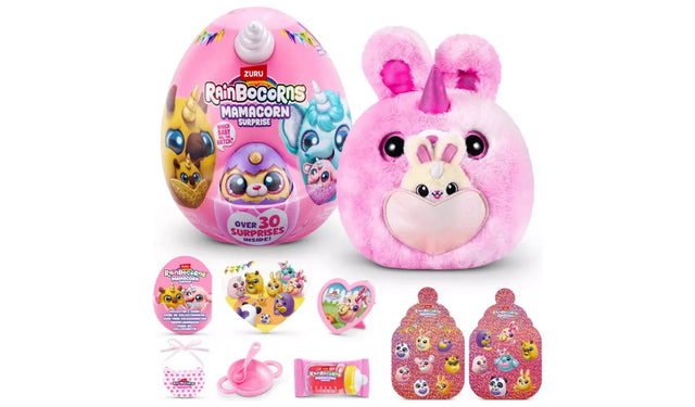 Rainbocorns Mamacorn Surprise pink plush Mamacorn with bunny ears and heart pouch holding baby, shown with egg and included accessories laid out