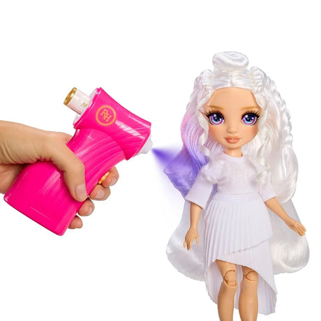 Rainbow High Air Brush & Create doll with long white curled hair and a white outfit, as a hand uses the pink airbrush tool to spray purple colour onto her hair.