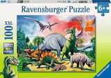 Ravensburger Among the Dinosaurs 100 piece XXL jigsaw puzzle box showing a prehistoric scene with T-Rex, stegosaurus, triceratops, pterodactyl, and erupting volcano