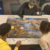 Three people building the Ravensburger Animal Kingdom 3000 Piece Jigsaw Puzzle