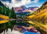 Ravensburger Aspen Colorado puzzle artwork showing the Maroon Bells mountains, autumn trees and their reflection in the lake