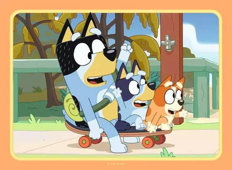 Bluey, Bingo and Bandit riding a skateboard together Ravensburger jigsaw puzzle scene