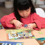 Child completing a Ravensburger Bluey 49 piece jigsaw at a table