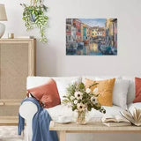 Completed Ravensburger Burano Italy puzzle displayed on a wall above a sofa, showing the colourful canal houses