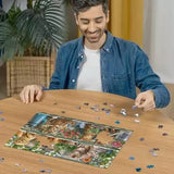 Man assembling the Ravensburger Cats on the Shelf jigsaw puzzle on a table with loose pieces around the cat artwork