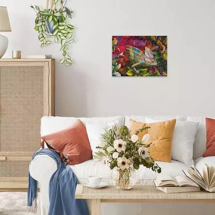 Finished Chameleon puzzle displayed on a wall above a sofa