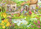 Ravensburger Cosy Café No 3 Valley Cafe Farm 1000 piece jigsaw puzzle artwork close up showing the thatched café, pond, ducks, chickens and people in a garden setting