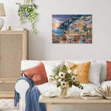 Completed Ravensburger Dinner in Positano puzzle displayed on a living room wall above a white sofa