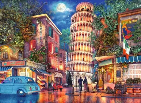 Ravensburger Evening in Pisa puzzle artwork showing the Leaning Tower of Pisa, illuminated buildings, café tables, a blue car and wet streets at night