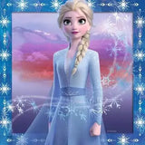 Frozen 2 puzzle artwork with blue snowflake border showing Elsa in her ice-blue dress against a purple and pink wintry sky