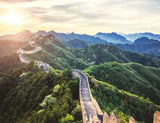 Ravensburger The Great Wall of China 2000 Piece puzzle artwork showing the wall winding across green mountain ridges
