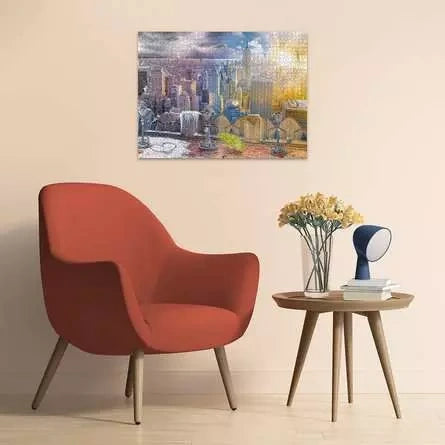 Completed Ravensburger New York Summer and Winter puzzle displayed on a wall above a red armchair and side table