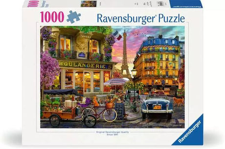 Ravensburger Paris at Dawn 1000 piece jigsaw puzzle box front showing a Paris street scene with the Eiffel Tower, bicycles and a parked car