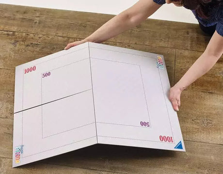 Ravensburger Puzzle Handy Fold & Go box showing setup diagram and example puzzle layout for 1000 piece jigsaws