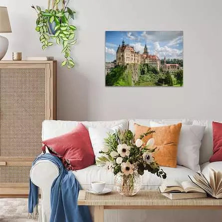 Ravensburger Sigmaringen Castle 1000 piece jigsaw puzzle displayed framed on a wall above a sofa