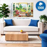 Ravensburger Summer Garden Parlour 1000 Piece puzzle size guide showing the completed 70 × 50 cm jigsaw above a sofa