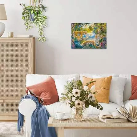 Finished Tiger Family in Oasis puzzle displayed on a living room wall above a sofa