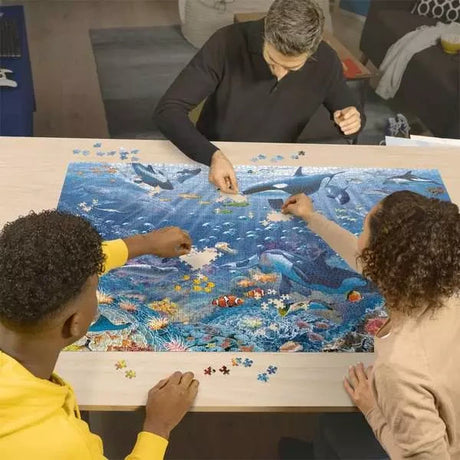 Ravensburger Colourful Underwater World 3000 Piece jigsaw puzzle being assembled on a table