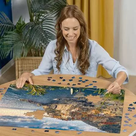 Ravensburger View of Cinque Terre, Italy 1500 piece jigsaw puzzle in progress on a table
