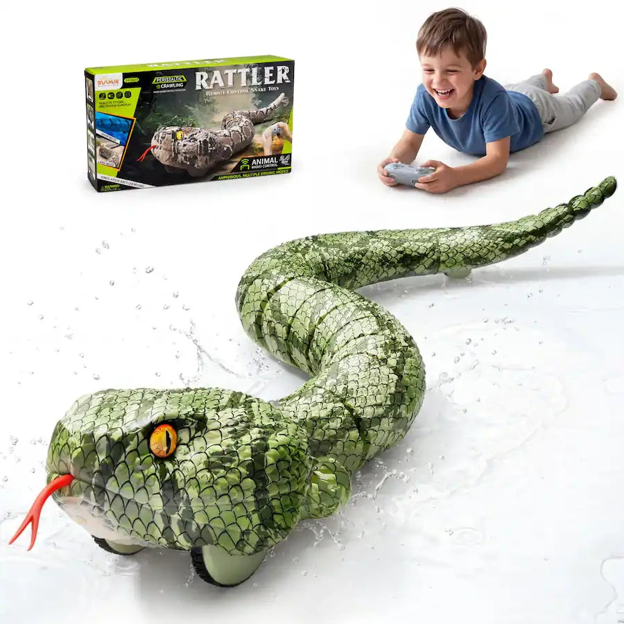 Green remote control snake with detailed scales, yellow eyes and red forked tongue, shown with water splashes. A boy holding a grey controller and the Rattler retail box appear above the snake.