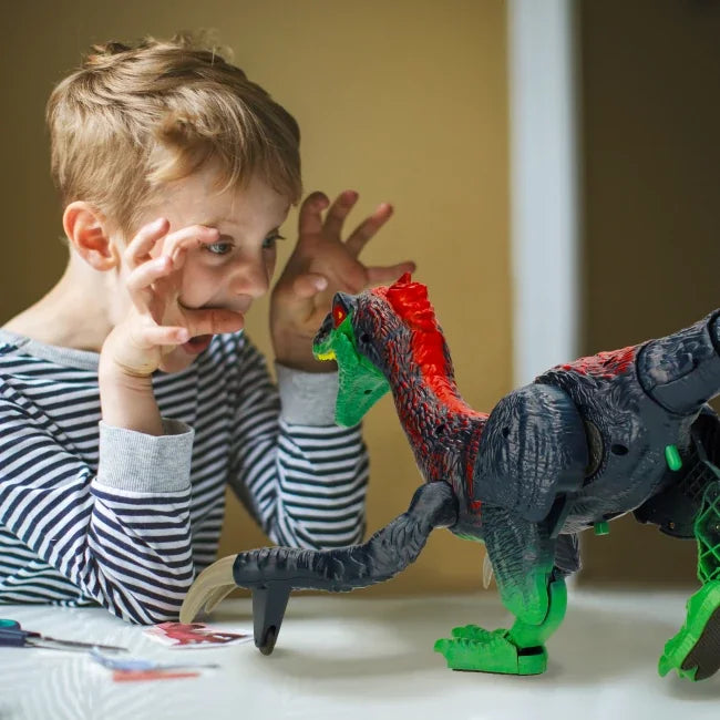 Child playing with remote control Therizinosaurus dinosaur toy in Ireland