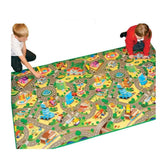 Two children playing on a large Rollmatz City Playmat featuring colourful streets, buildings, road junctions and miniature vehicles